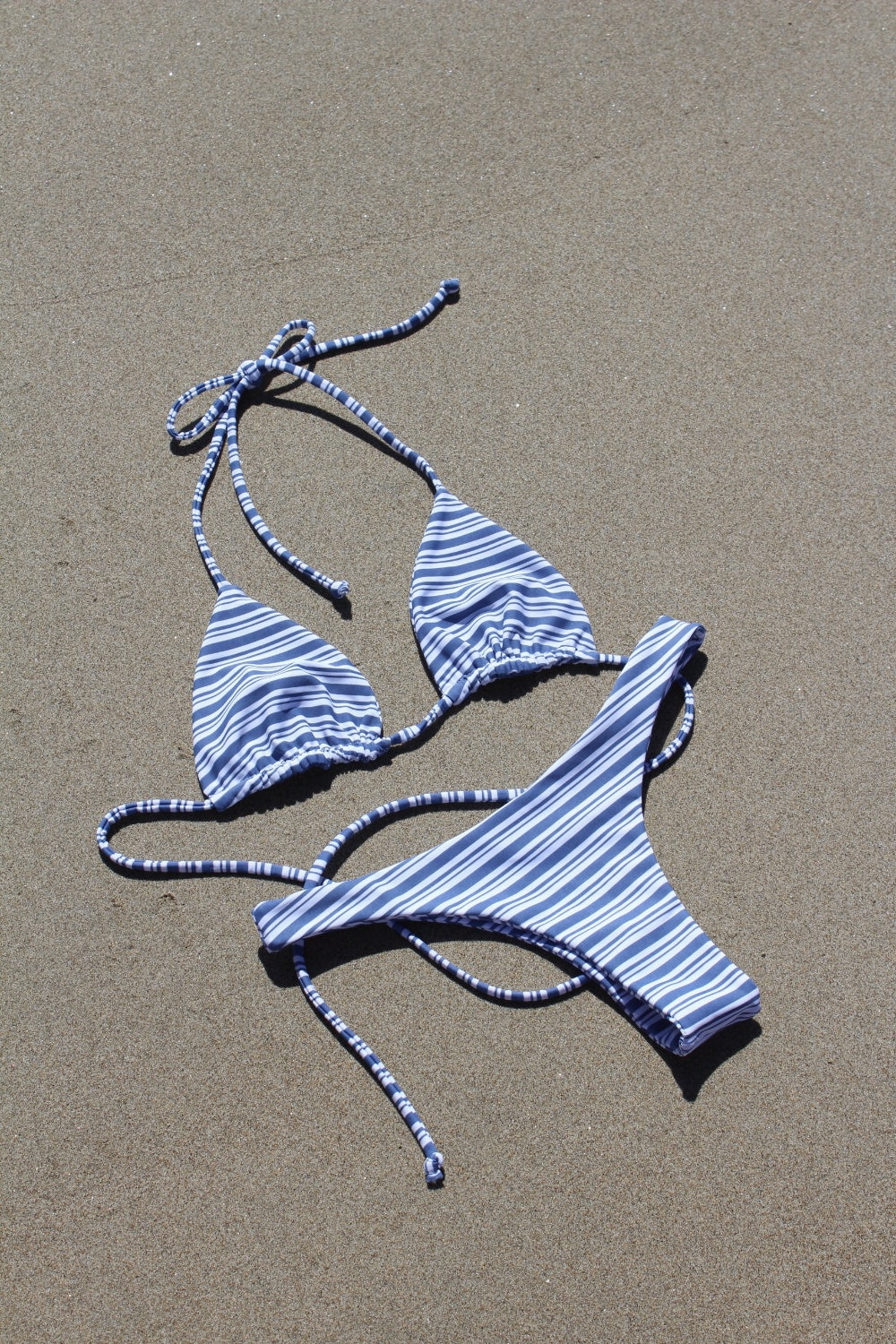 Blue striped cheeky bikini bottoms with minimal coverage